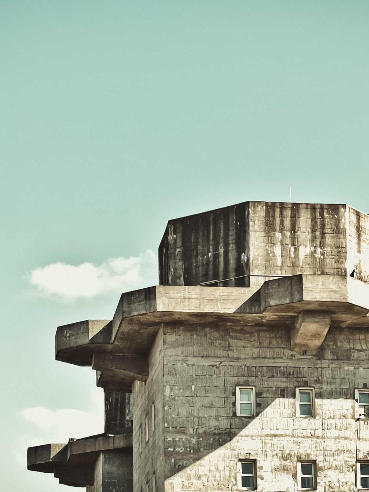 Brutalist concrete massing against an open sky